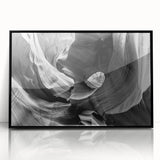 Large abstract wall art of Antelope Canyon in Arizona, featuring sweeping orange and red tones on a framed acrylic print.