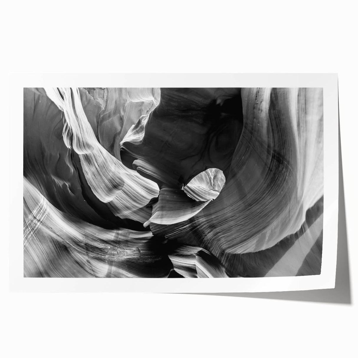 Antelope Canyon in Arizona depicted in vibrant orange and red tones on a large rolled canvas.