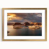 Extra large abstract art print of Lake Powell in muted earth tones, framed in gold, ideal for living room decor.