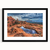 Extra large abstract art print of Sedona landscape in vibrant, colorful hues on a textured canvas, framed in black.