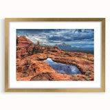 Extra large abstract art print of Sedona landscape in gold frame, featuring textured red and orange hues.