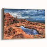 Framed canvas of Sedona landscape with reddish hues and black frame, ideal for bedroom wall art.