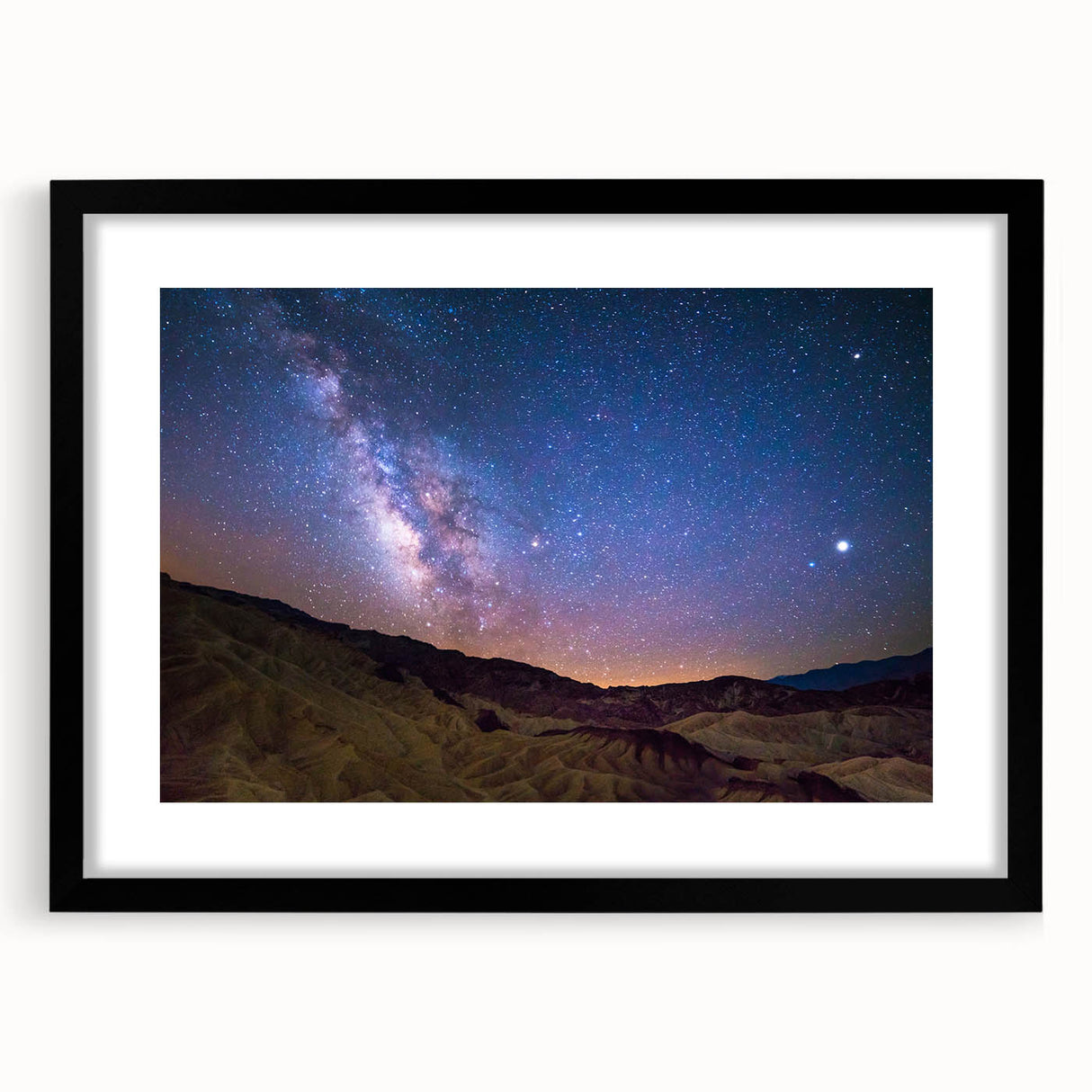 Abstract art print of Death Valley in colorful, textured strokes on a large framed canvas, ideal for living room decor.
