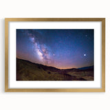 Extra large abstract art print of Death Valley in textured hues of orange and brown on a gold-framed canvas.