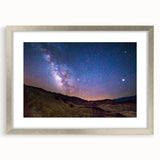 Textured art depicting Death Valley in muted earth tones on a framed silver mat, ideal for bedroom art.