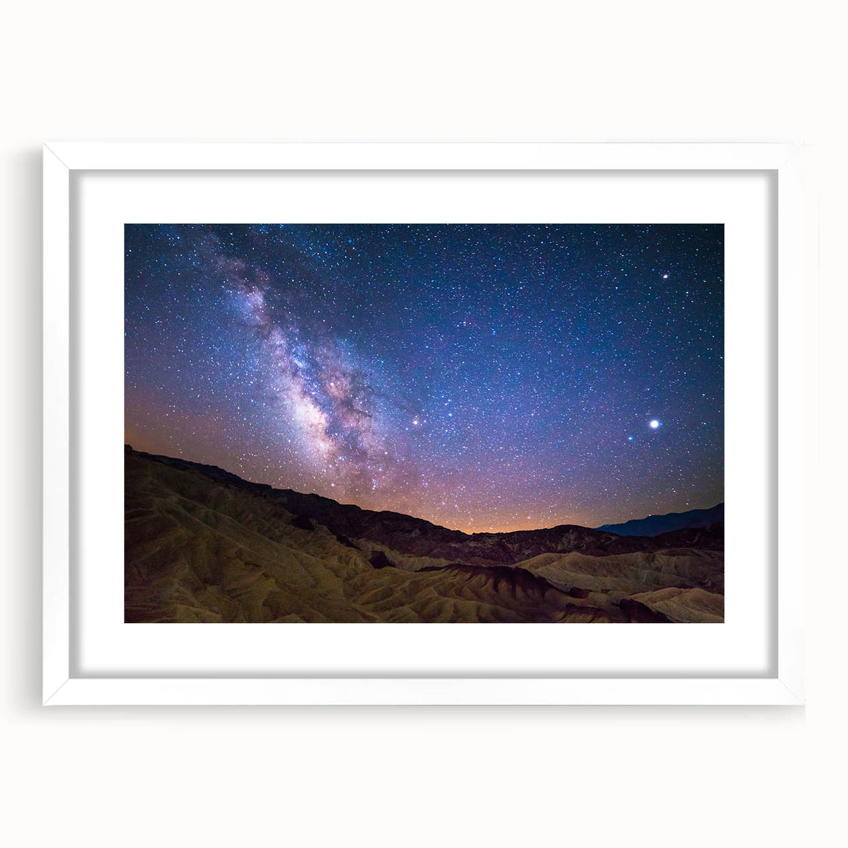 Abstract art print of Death Valley in muted earth tones on a white framed canvas, ideal for dining room decor.