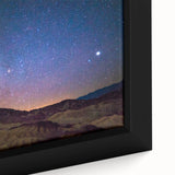 Framed canvas depicting Death Valley with textured black foreground and colorful sunset, ideal for large living room walls.