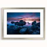 Textured abstract art print of Lake Tahoe in muted blue and gray tones, framed in silver, ideal for bedroom art.