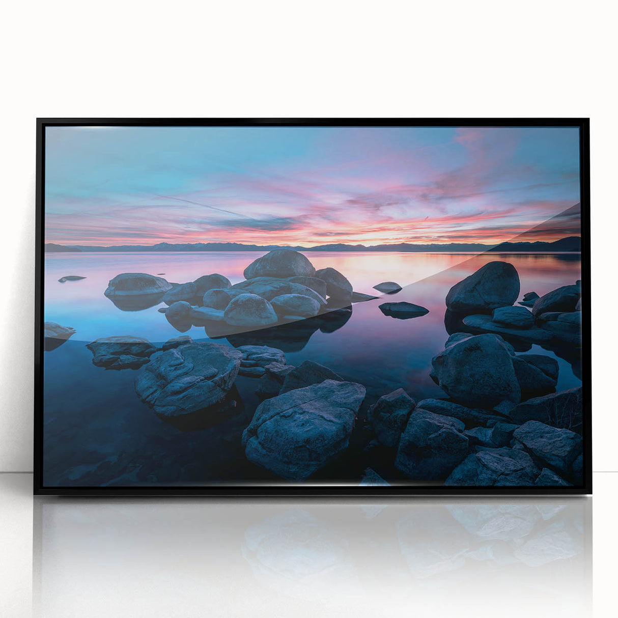 Large abstract wall art depicting Lake Tahoe in muted blue and green tones, framed in black acrylic.