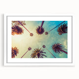Abstract art print of Los Angeles skyline in muted gray and blue tones, framed with a white mat.