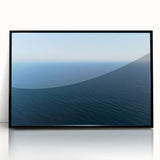 Large abstract wall art depicting Santa Monica scenery in muted gray and blue tones, framed in black acrylic.