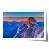 Yosemite landscape on rolled print, featuring muted green and blue tones, suitable for dining room wall art.
