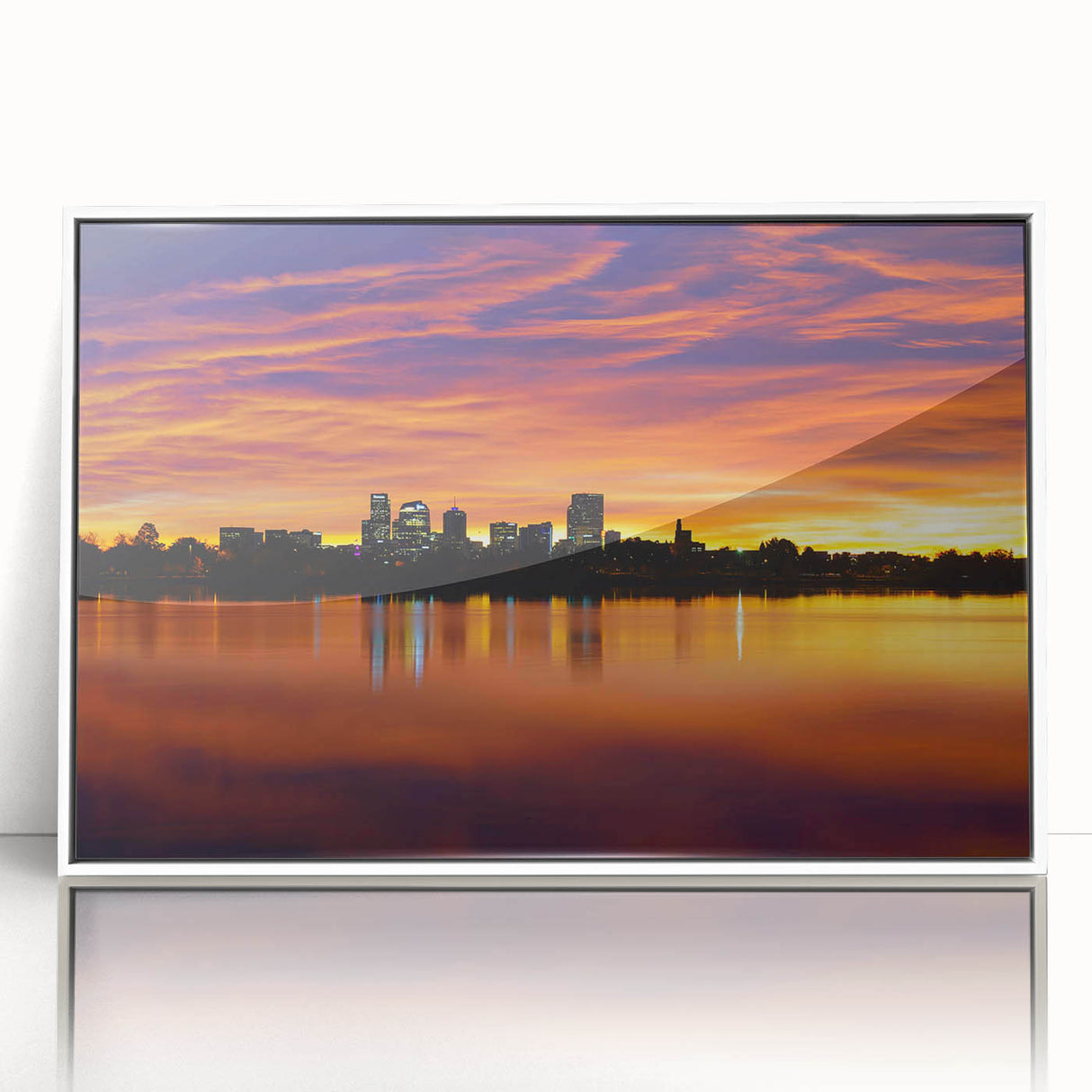 Acrylic print of Denver skyline in muted gray and blue tones, framed in white, suitable for modern art wall decor.