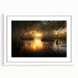 Abstract art print of the Everglades in muted green and blue tones, framed with a white mat, suitable for dining room decor.