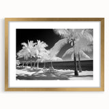 Extra large abstract art print of Florida Keys scenery in muted blue and green tones, displayed in a gold frame with mat.