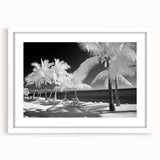 Abstract art print of the Florida Keys in blue and green tones on a white framed mat, suitable for dining room decor.