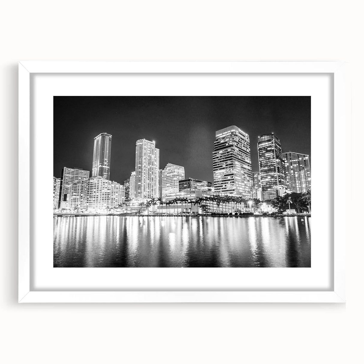 Abstract art print of Miami skyline in vibrant sunset colors on a framed white mat, ideal for dining room decor.