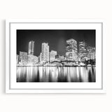 Abstract art print of Miami skyline in vibrant sunset colors on a framed white mat, ideal for dining room decor.