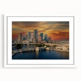 Abstract art print of Tampa skyline in muted blue and gray, framed with a white mat, suitable for dining room decor.