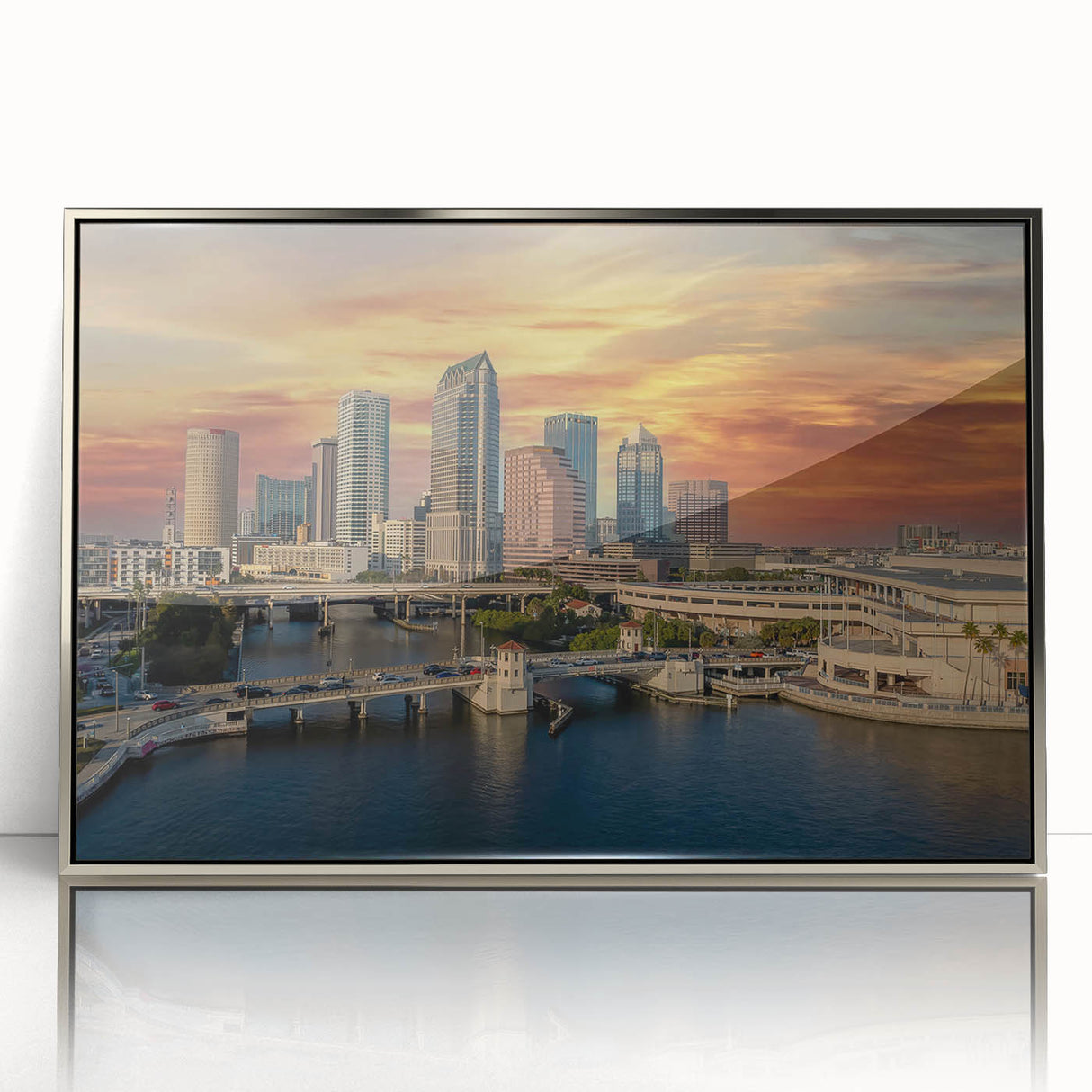 Mid-century modernist art of Tampa skyline in silver acrylic frame, with cool blue and gray palette.