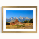 Extra large abstract art print depicting a textured Idaho scenery in muted earth tones, framed with a gold mat.