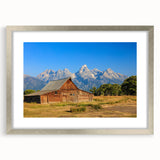 Textured abstract art print of Idaho scenery in muted earth tones, framed with a silver mat, suitable for bedroom decor.