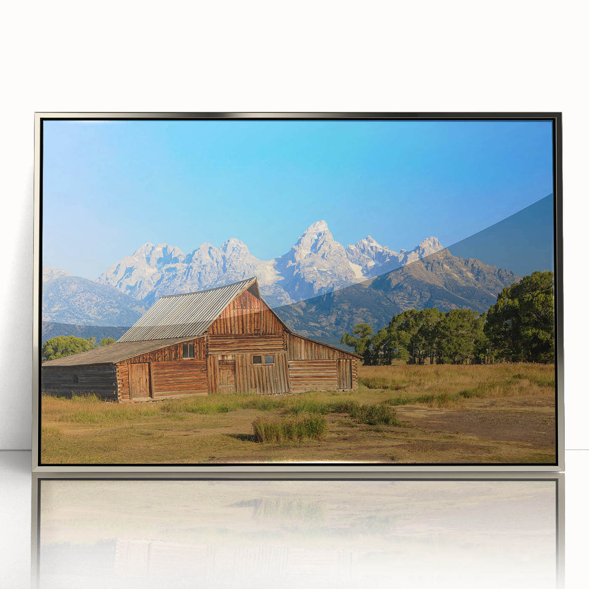 Mid-century modernist art depicting Idaho scenery in muted earth tones on a silver-framed acrylic print.