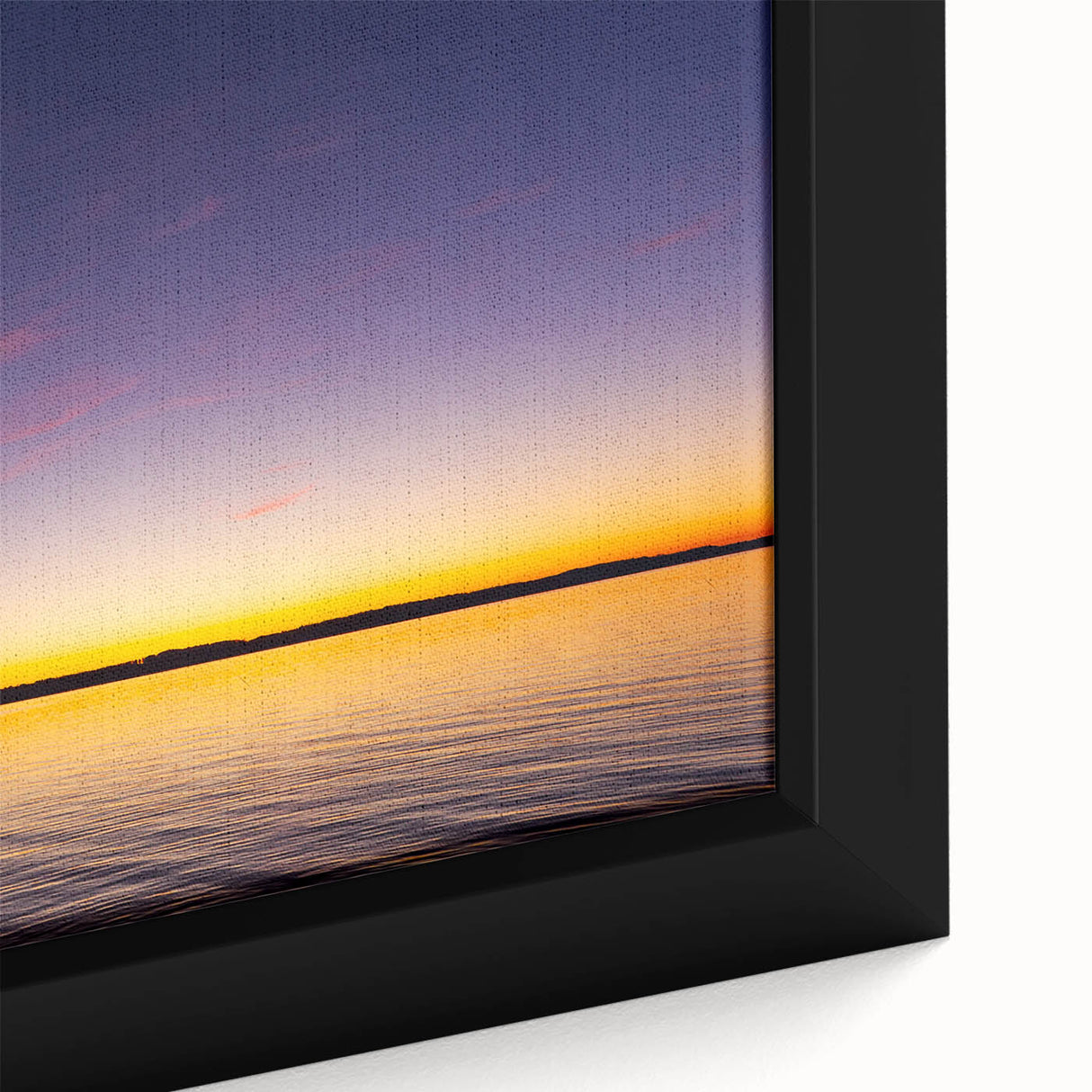 Black wall art featuring a textured depiction of Lake Michigan with colorful accents on a framed canvas.
