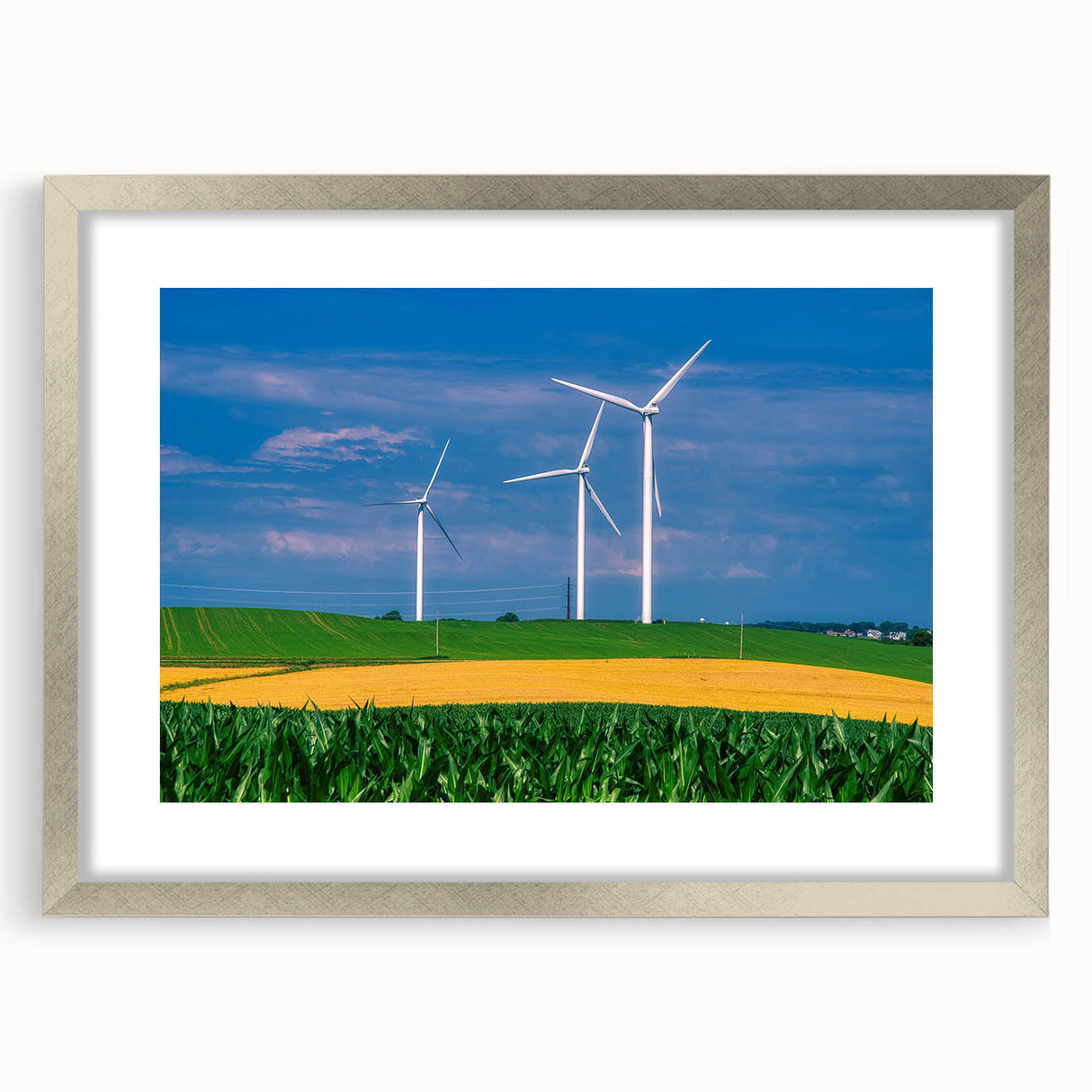 Textured abstract art print of Iowa scenery in muted earth tones, framed in silver, suitable for bedroom decor.