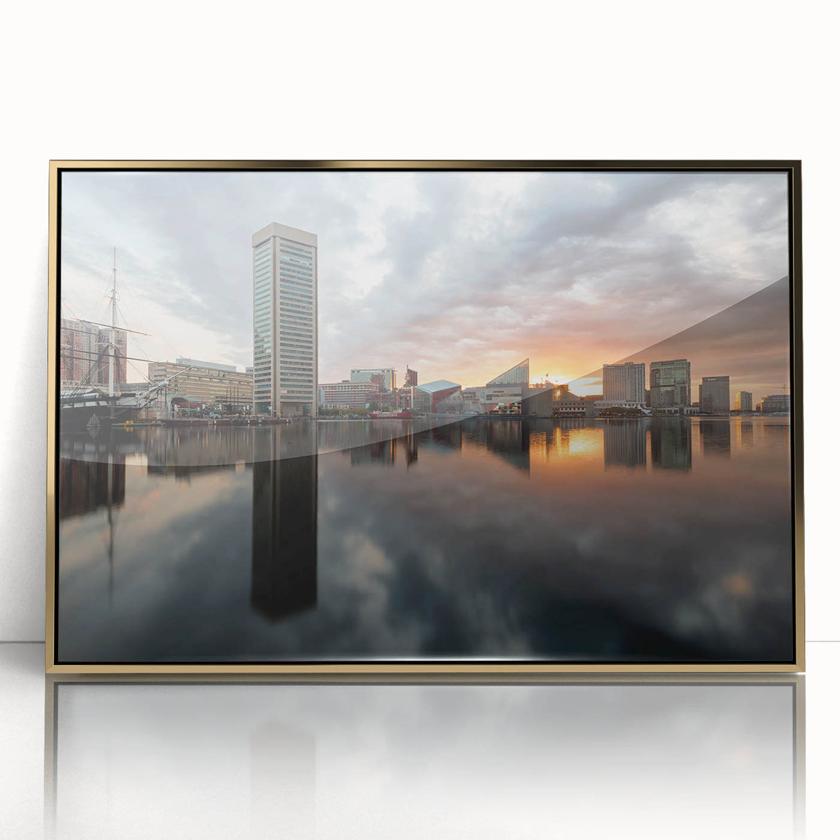 Framed acrylic print of Baltimore skyline in muted gold and blue tones, suitable as modern art wall decor.