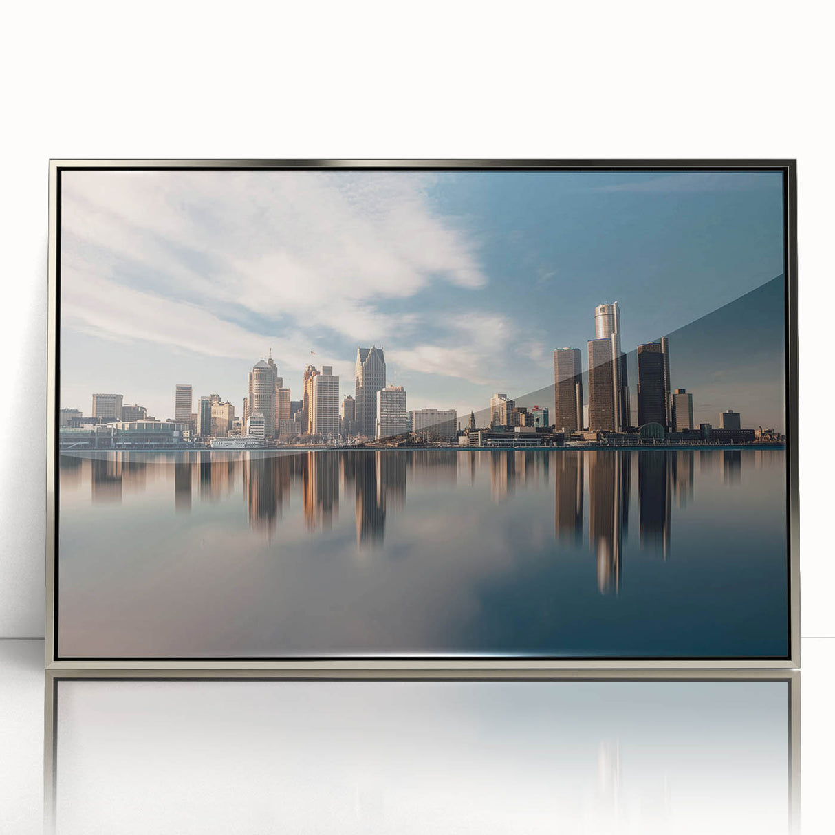 Mid-century modernist art depicting Detroit skyline in muted gray tones on a silver-framed acrylic print.