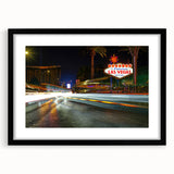 Colorful abstract art print of Las Vegas scenery in a black frame, ideal for extra large wall art in a living room.