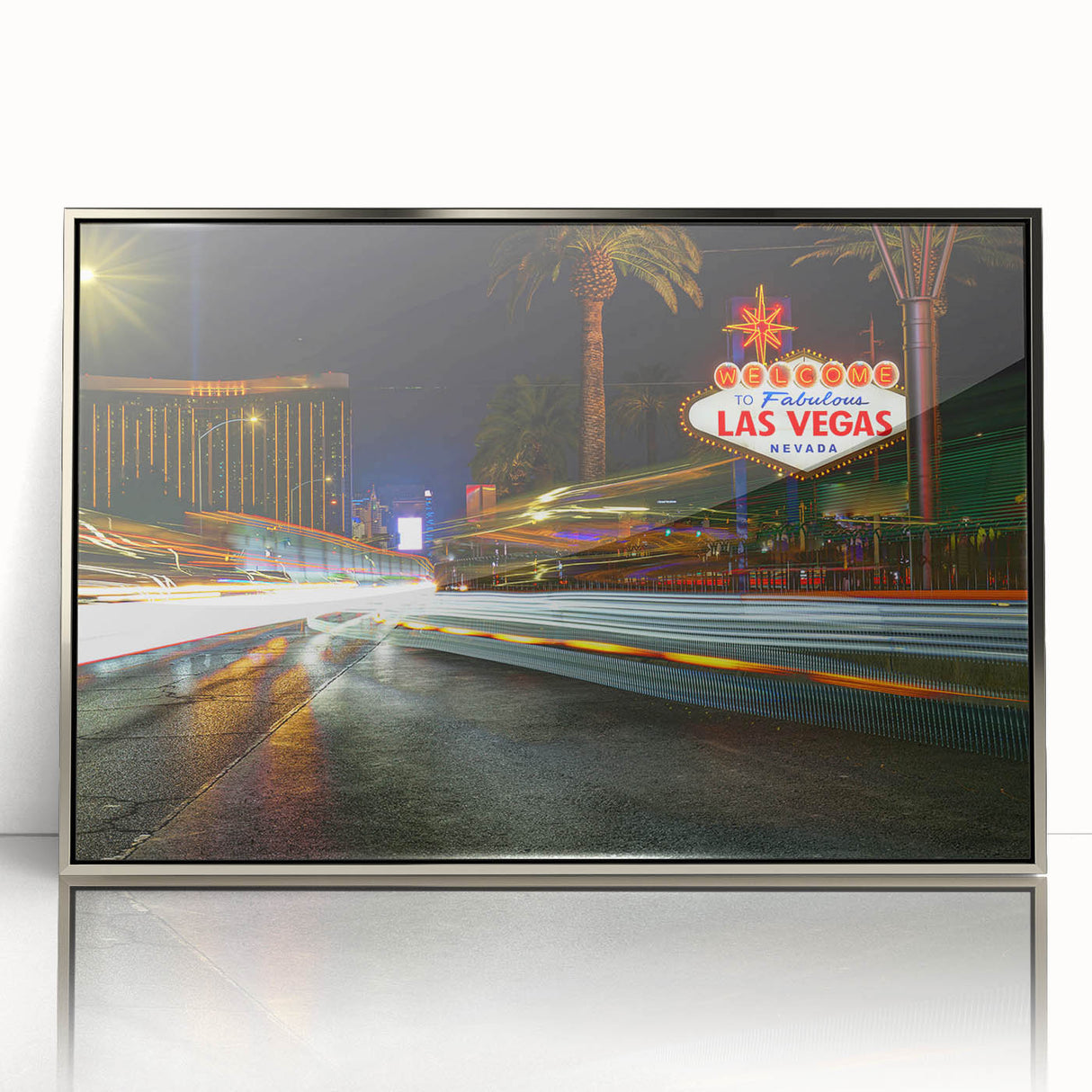 Mid-century modernist art of Las Vegas skyline in silver framed acrylic, with vibrant neon colors.