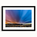 Abstract art print featuring textured swirls in vibrant colors, framed in black, ideal for living room decor.