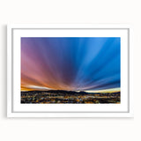 Abstract art print of a New Mexico landscape in muted earth tones on a framed white mat, suitable for dining room decor.