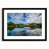 Abstract art print of Charlotte skyline featuring vibrant, colorful textures on a large framed canvas.