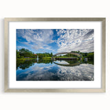 Textured abstract art print of the Charlotte skyline in muted gray tones, framed in silver, ideal for bedroom art.