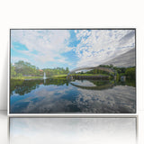 Acrylic print of Charlotte skyline in muted blue shades, framed in white, suitable as modern art wall decor for a nursery.