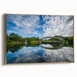 Framed canvas wall art featuring a vintage-style landscape of Charlotte, North Carolina, in muted gold and black tones.