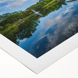 Art deco poster of Charlotte skyline in muted blue and gray tones on rolled canvas, suitable for dining room wall art.