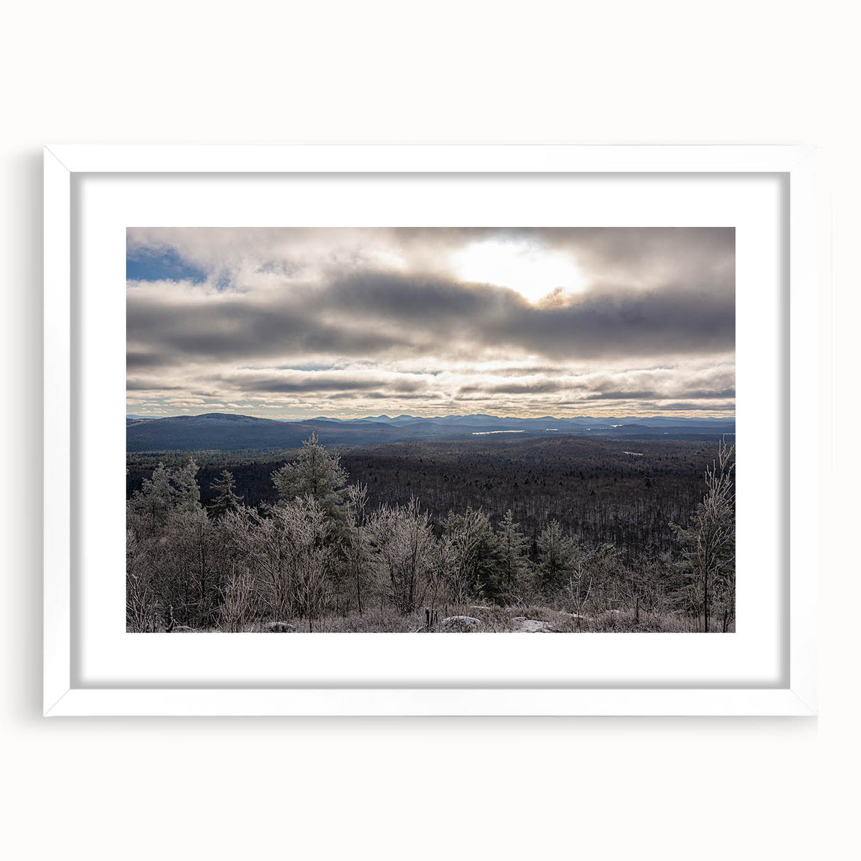 Abstract art print of Adirondack scenery in muted earth tones on a framed white canvas, ideal for dining room decor.