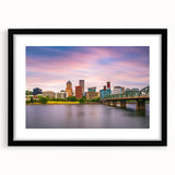 Extra large abstract art print of colorful, textured scenery, mounted in a black frame with mat, ideal for living room decor.