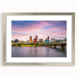 Textured abstract art print of Portland, Oregon, in muted gray tones on a silver-framed canvas, suitable for bedroom decor.