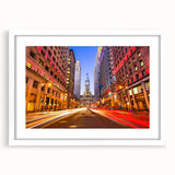 Abstract art print of Philadelphia skyline in muted blue and gray tones on a framed white mat, ideal for dining room decor.