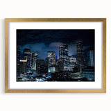 Extra large abstract art print of Houston skyline in muted gray and gold tones, framed with a gold mat.