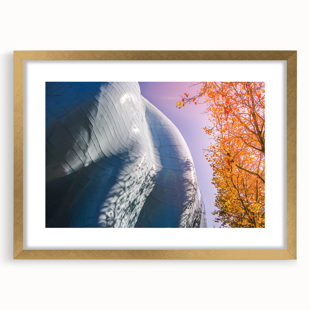 Extra large abstract art print of Seattle skyline in gold frame, featuring textured brush strokes and cool gray hues.