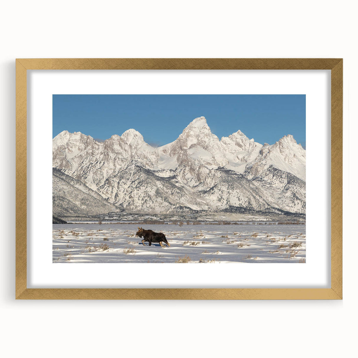 Extra large framed wall art featuring an abstract depiction of the Grand Tetons in textured gold and brown tones.