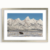 Textured art print of the Grand Tetons in muted earth tones on a framed silver mat, suitable for bedroom decor.