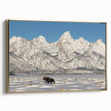 Framed canvas depicting the Grand Tetons in Wyoming with a vintage poster art style, featuring muted earth tones.