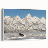 Framed canvas of vintage poster art featuring the Grand Tetons in Wyoming, depicted in vibrant colors on a black background.